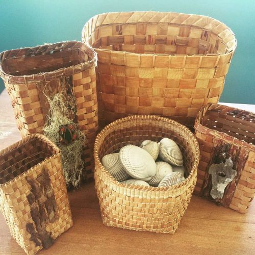Silvey sometimes incorporates found eagle down feathers from the beach, bark and twigs into her baskets and wall hangings. Photo courtesy Red Cedar Woman Weaving Studio.